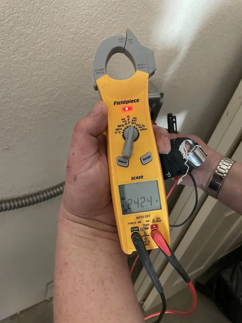 Voltage testing with clamp meter during Whole House Surge Protector in Carrollton